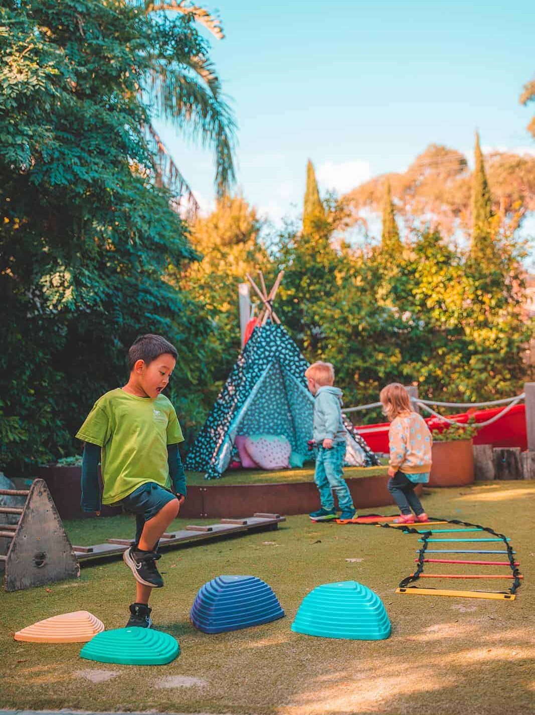 Children engaged in outdoor activities at Little Grasshoppers Early Learning Center